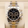 Two-tone chronograph watch on wrist