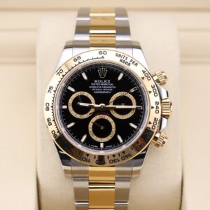 Two-tone chronograph watch on wrist
