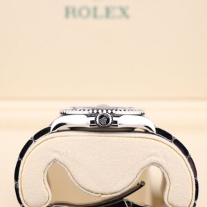 Luxury watch with blue dial and luminous hands