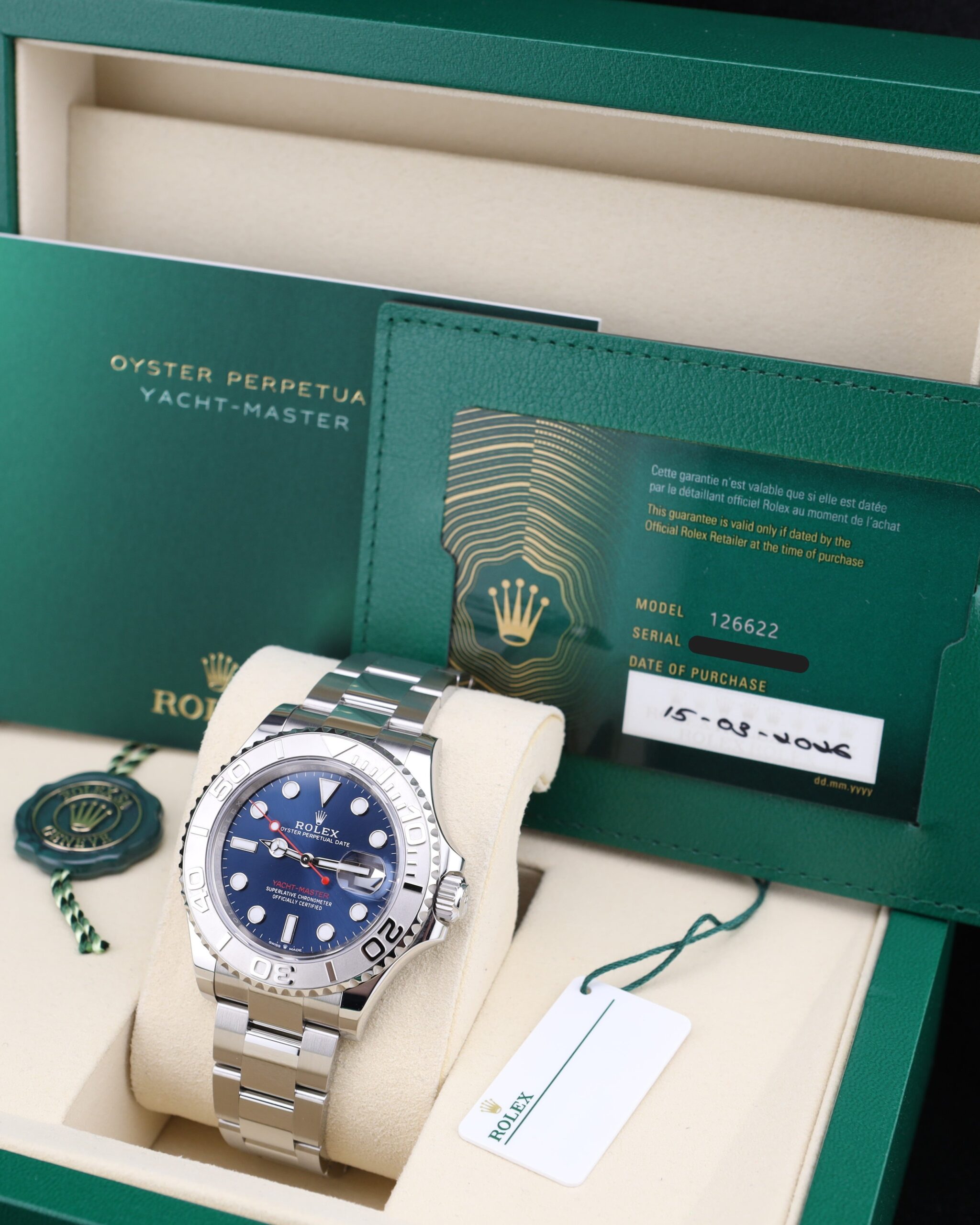 Luxury wristwatch on wrist with blue dial