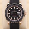 Rose gold sports watch on black strap