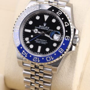 Side profile of luxury watch with blue and black bezel