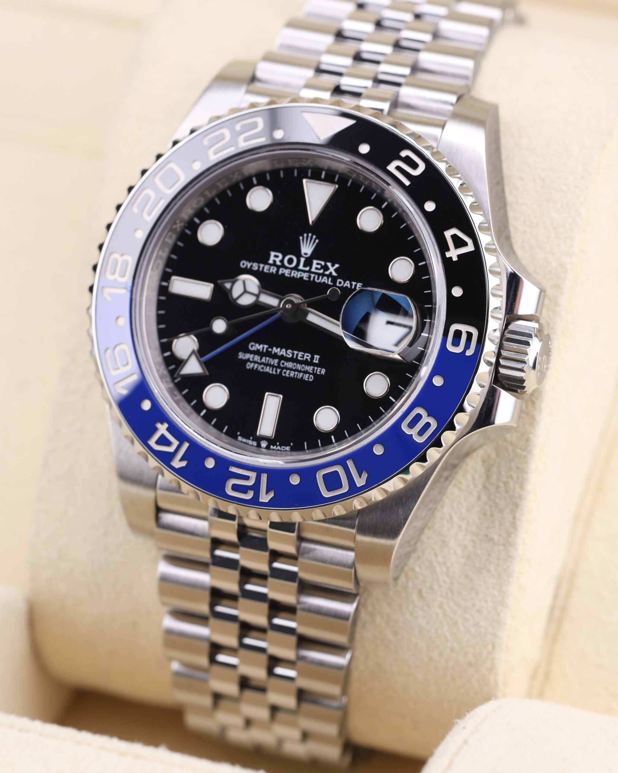 Side profile of luxury watch with blue and black bezel