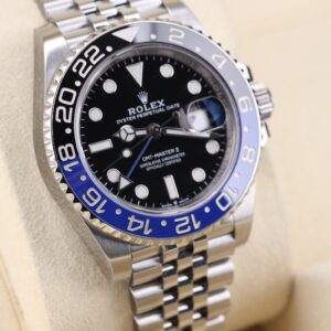 Close-up of wristwatch with blue and black bezel