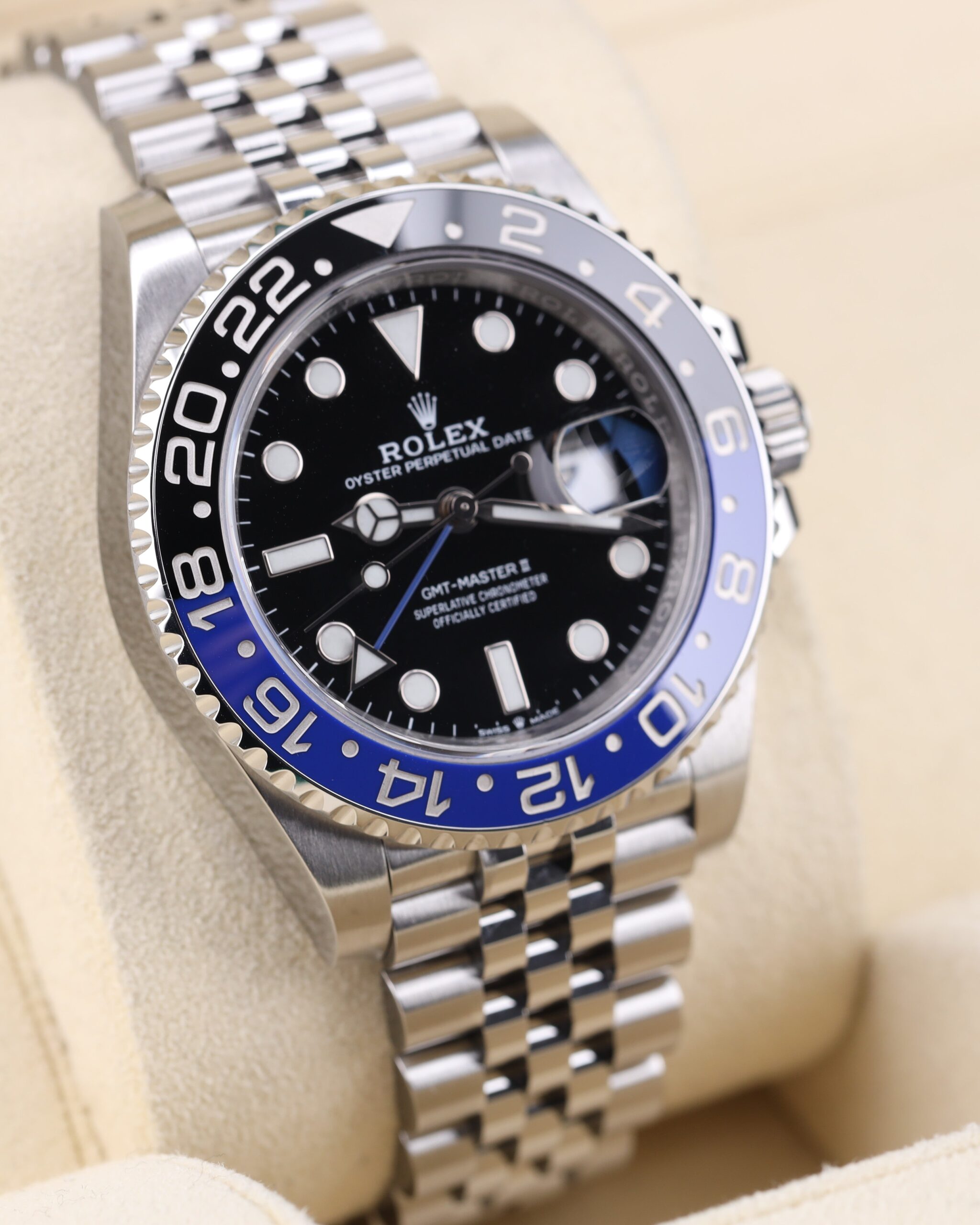 Close-up of wristwatch with blue and black bezel