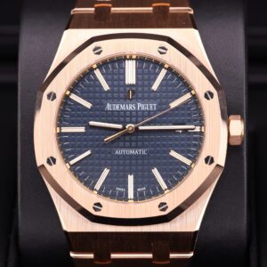 Luxury watch on wrist with blue dial