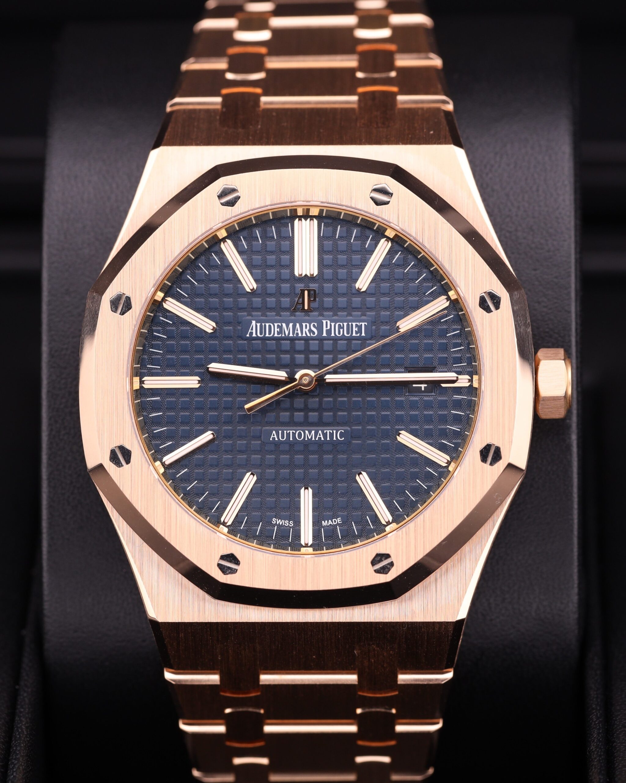 Luxury watch on wrist with blue dial