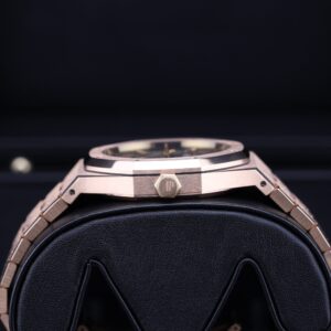 Rose gold wristwatch with blue dial on wrist