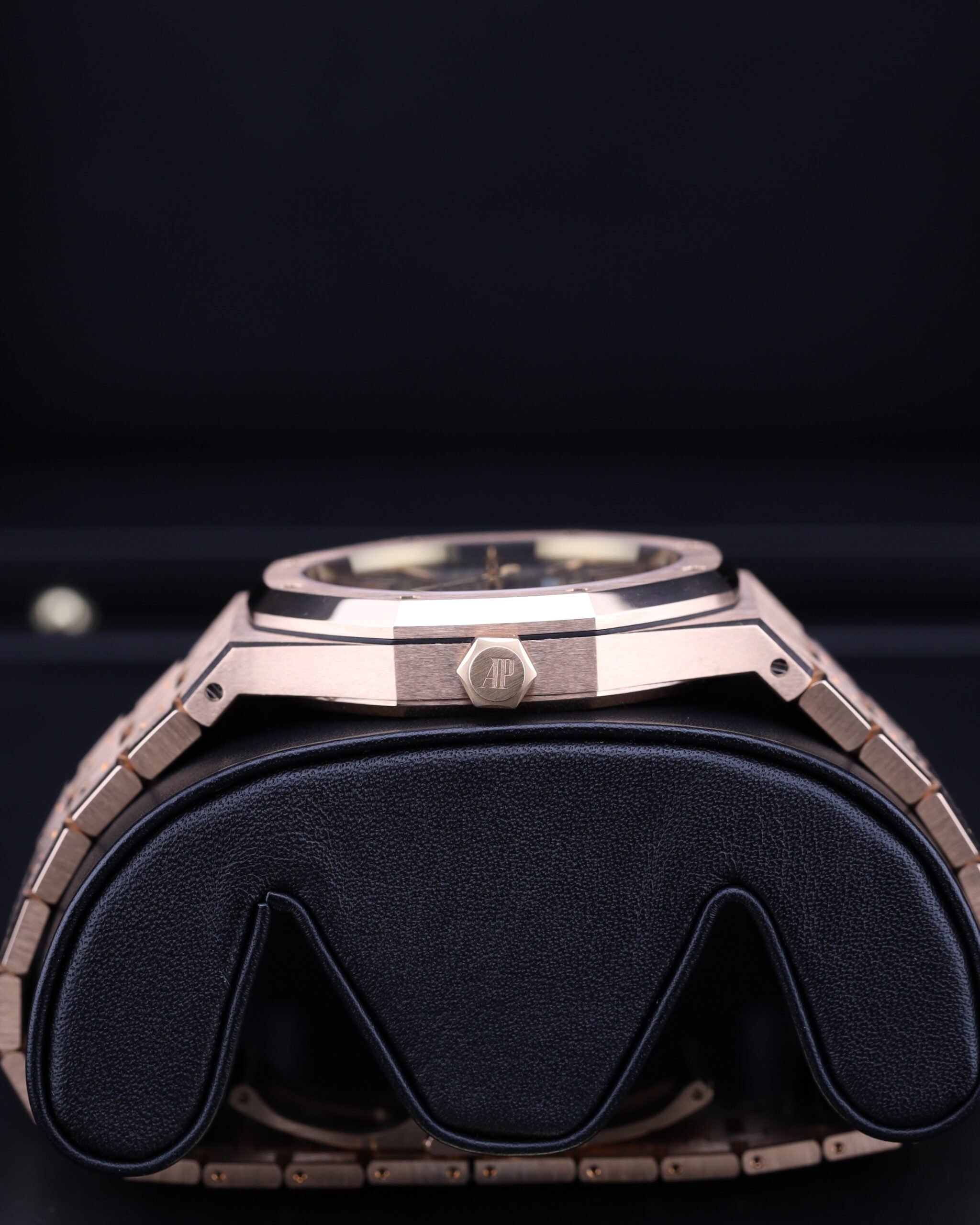 Rose gold wristwatch with blue dial on wrist