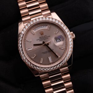 Close-up of luxury watch pink bezel and diamonds