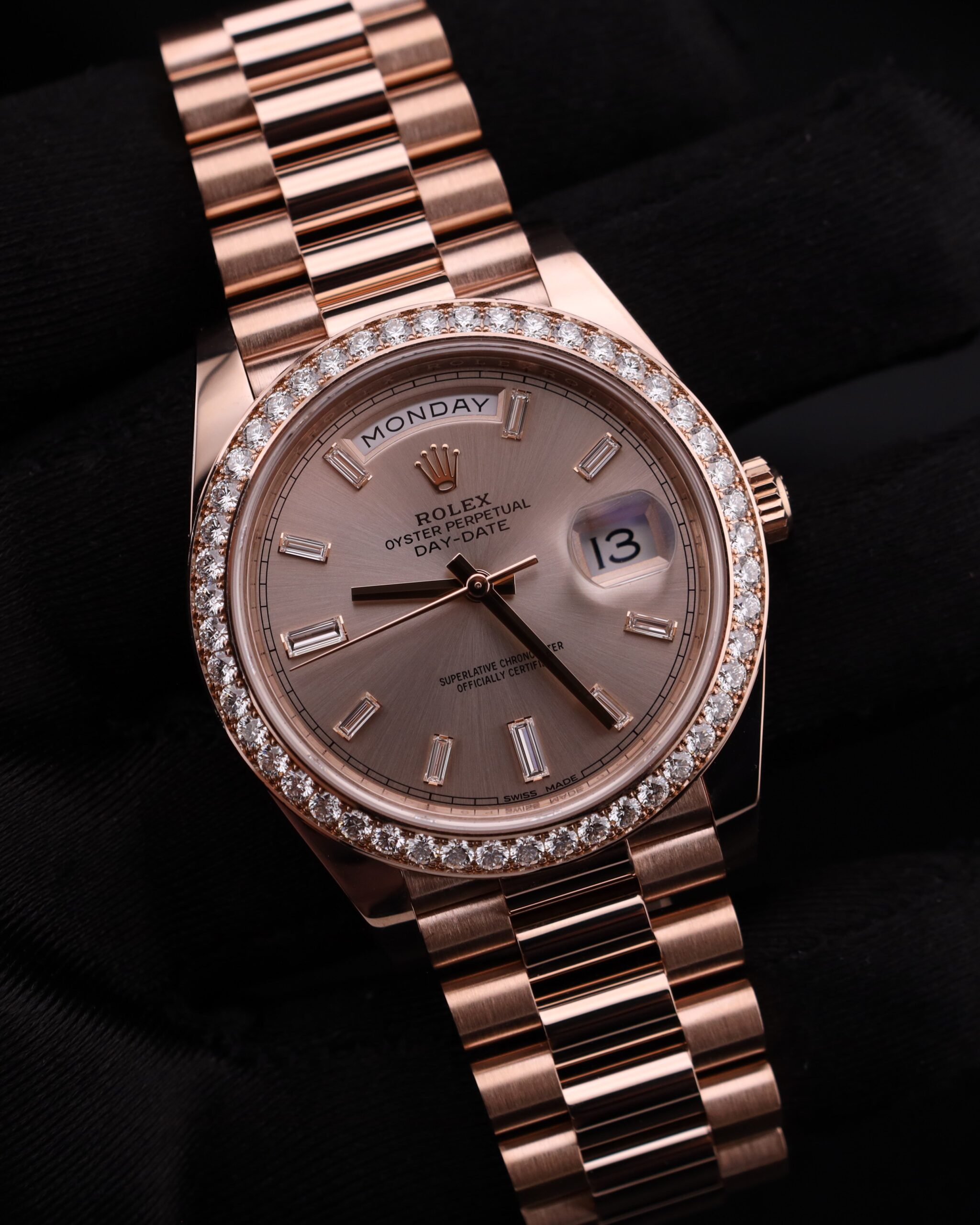 Close-up of luxury watch pink bezel and diamonds
