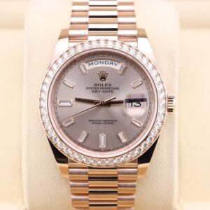 Pink bezel watch on wrist with diamond markers
