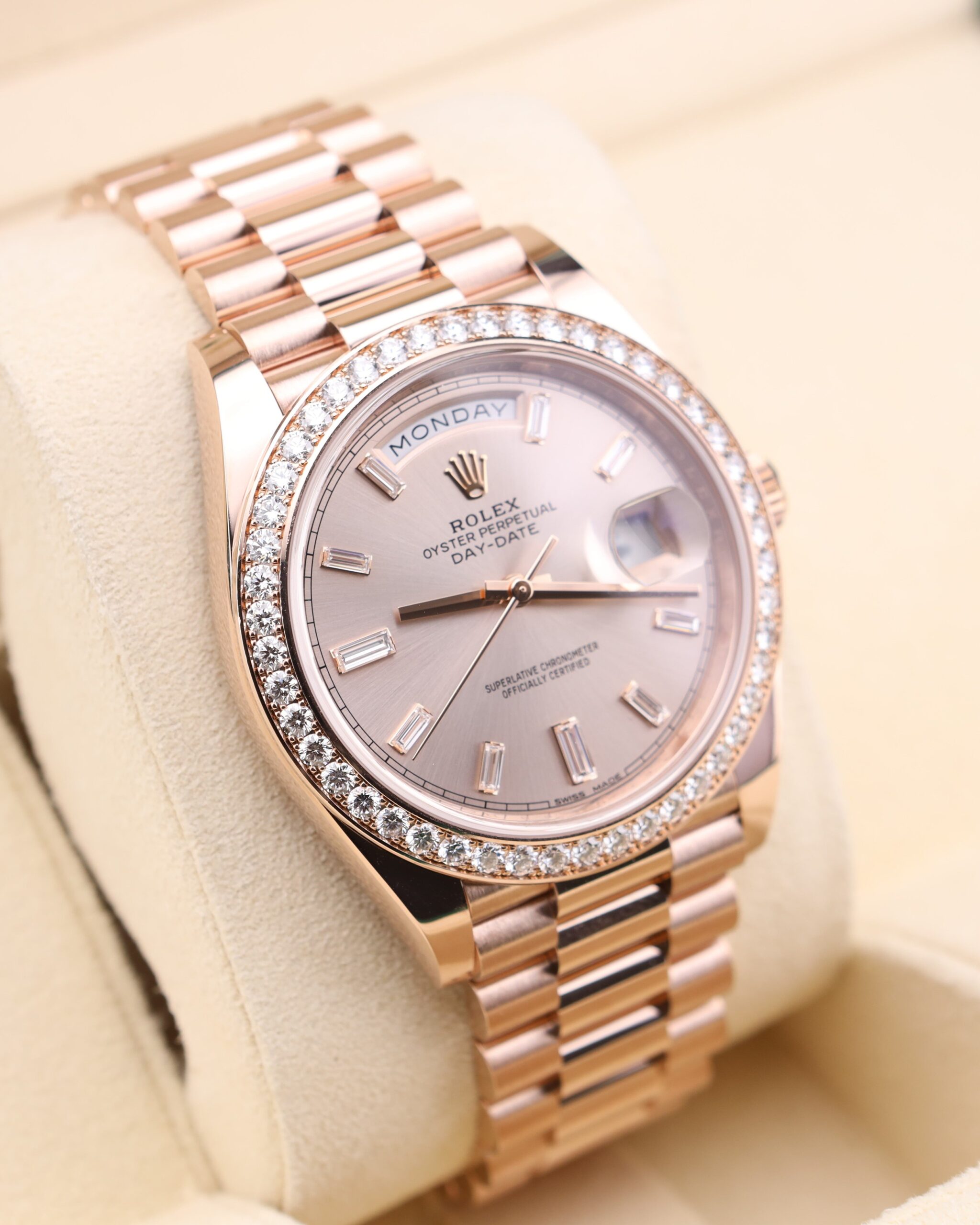 Close-up of pink bezel luxury watch dial