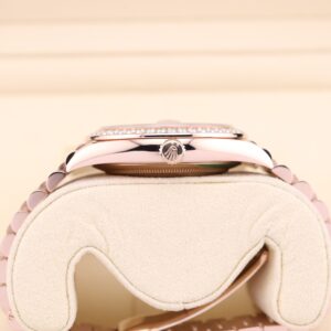 Close-up of pink bezel luxury wristwatch dial