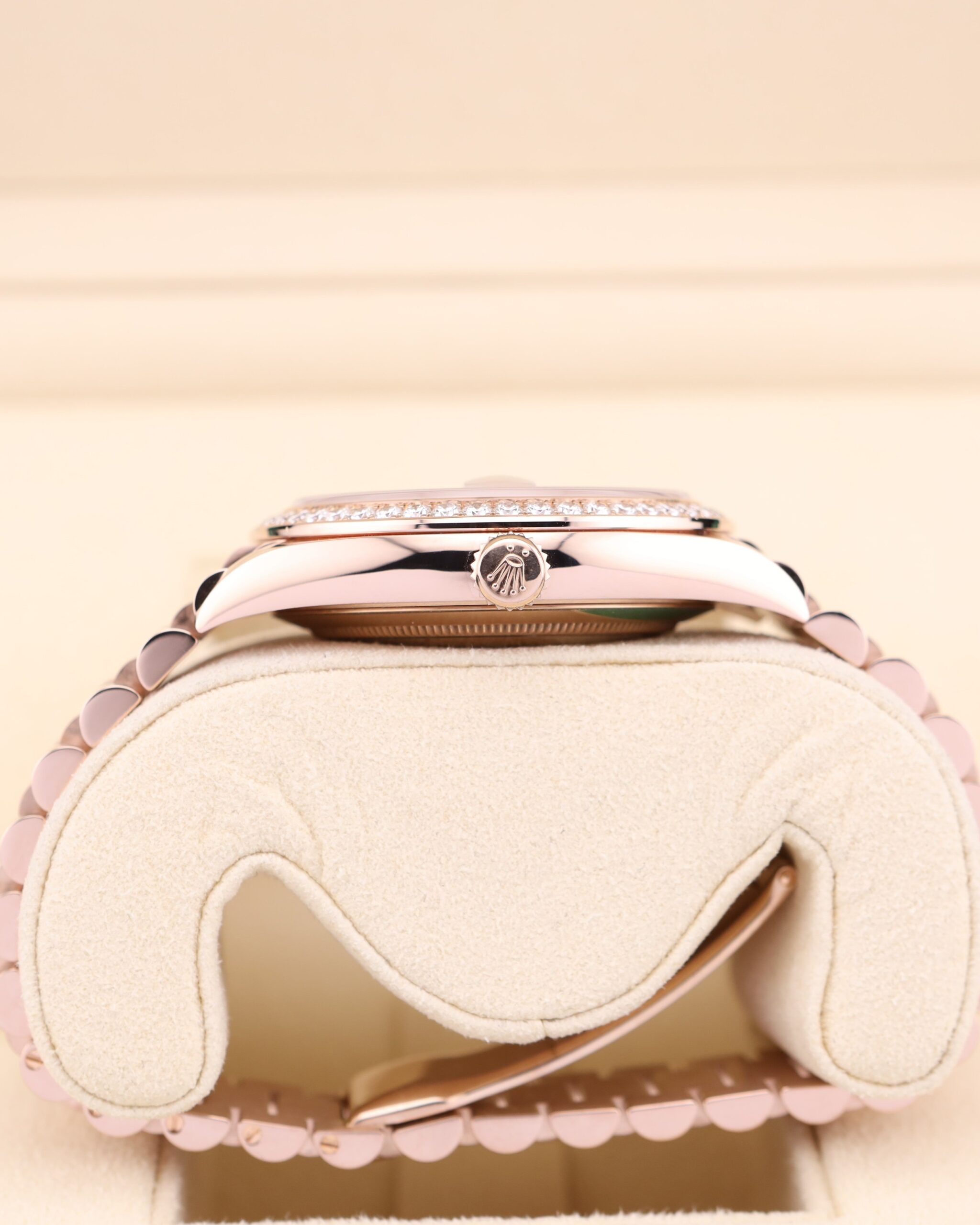Close-up of pink bezel luxury wristwatch dial