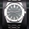 Green dial luxury wristwatch close-up