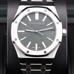 Green dial luxury wristwatch close-up
