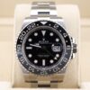 Luxury wristwatch with green and black bezel