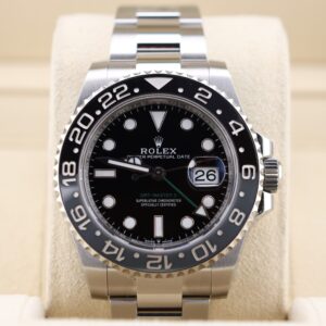 Luxury wristwatch with green and black bezel