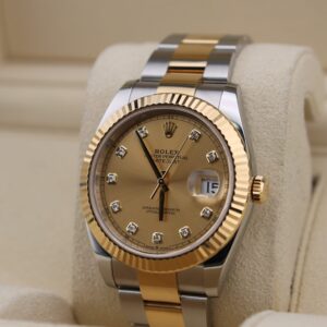 Close-up of diamond champagne dial watch