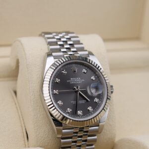 Luxury wristwatch bracelet and diamond dial close-up