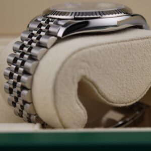 Side angle of luxury wristwatch with polished bezel