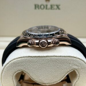 Rose gold watch with black dial on wrist