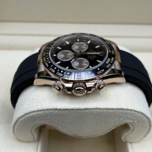 Close-up of black dial rose gold chronograph