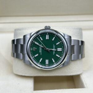Green dial watch with luminous hands and markers