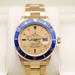 Rolex Submariner in yellow gold on wrist