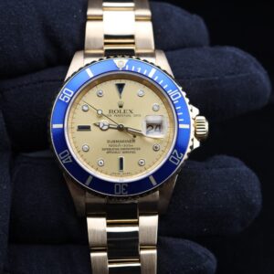 Yellow gold Rolex Submariner with champagne dial