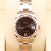 Luxury watch with chocolate dial and diamond markers
