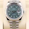 Luxury watch with mint green dial and fluted bezel