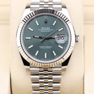 Luxury watch with mint green dial and fluted bezel