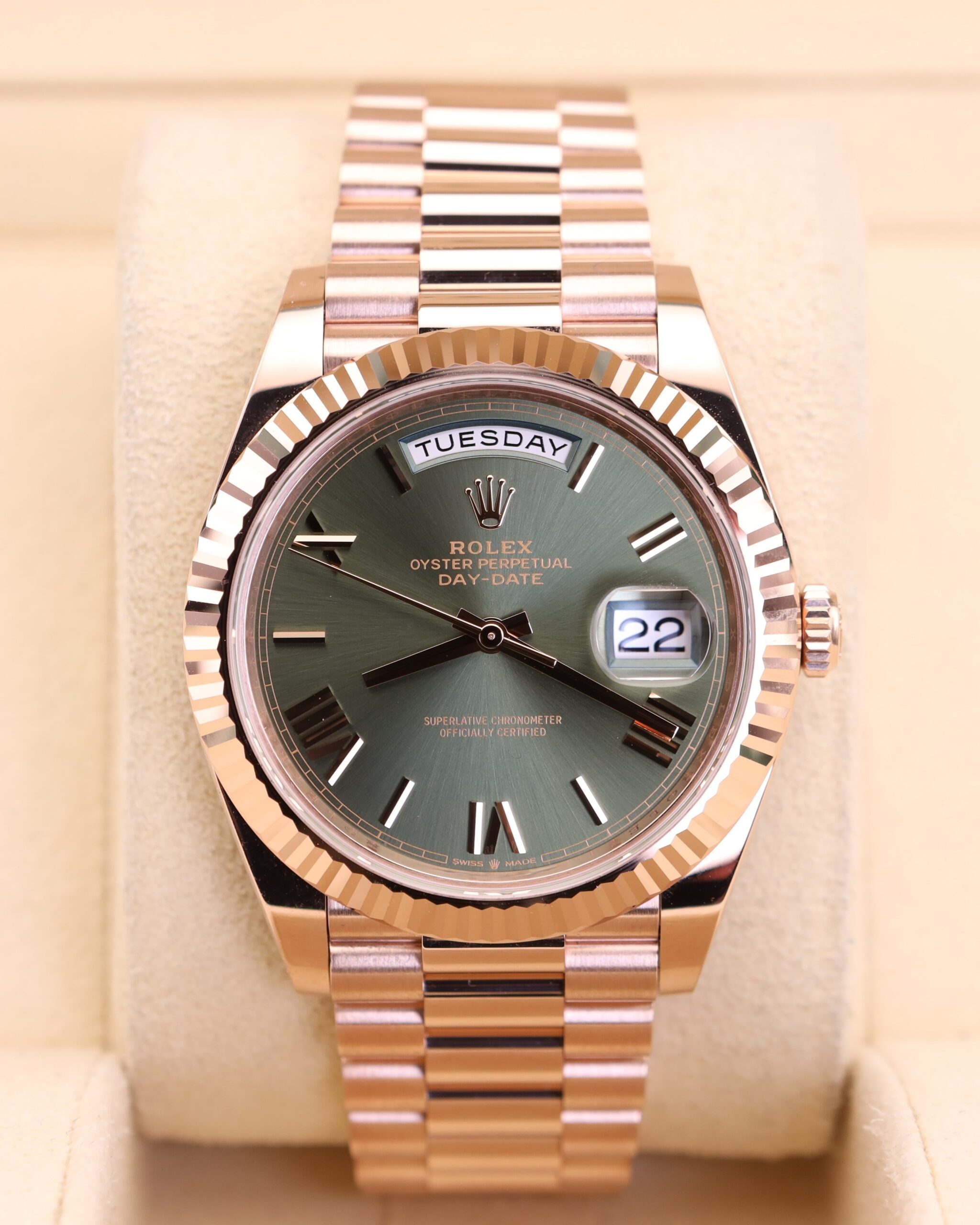 Luxury rose gold watch with olive green dial