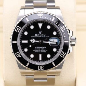Black dial Submariner style watch on metal bracelet