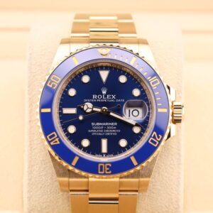 Yellow gold diver watch with blue bezel