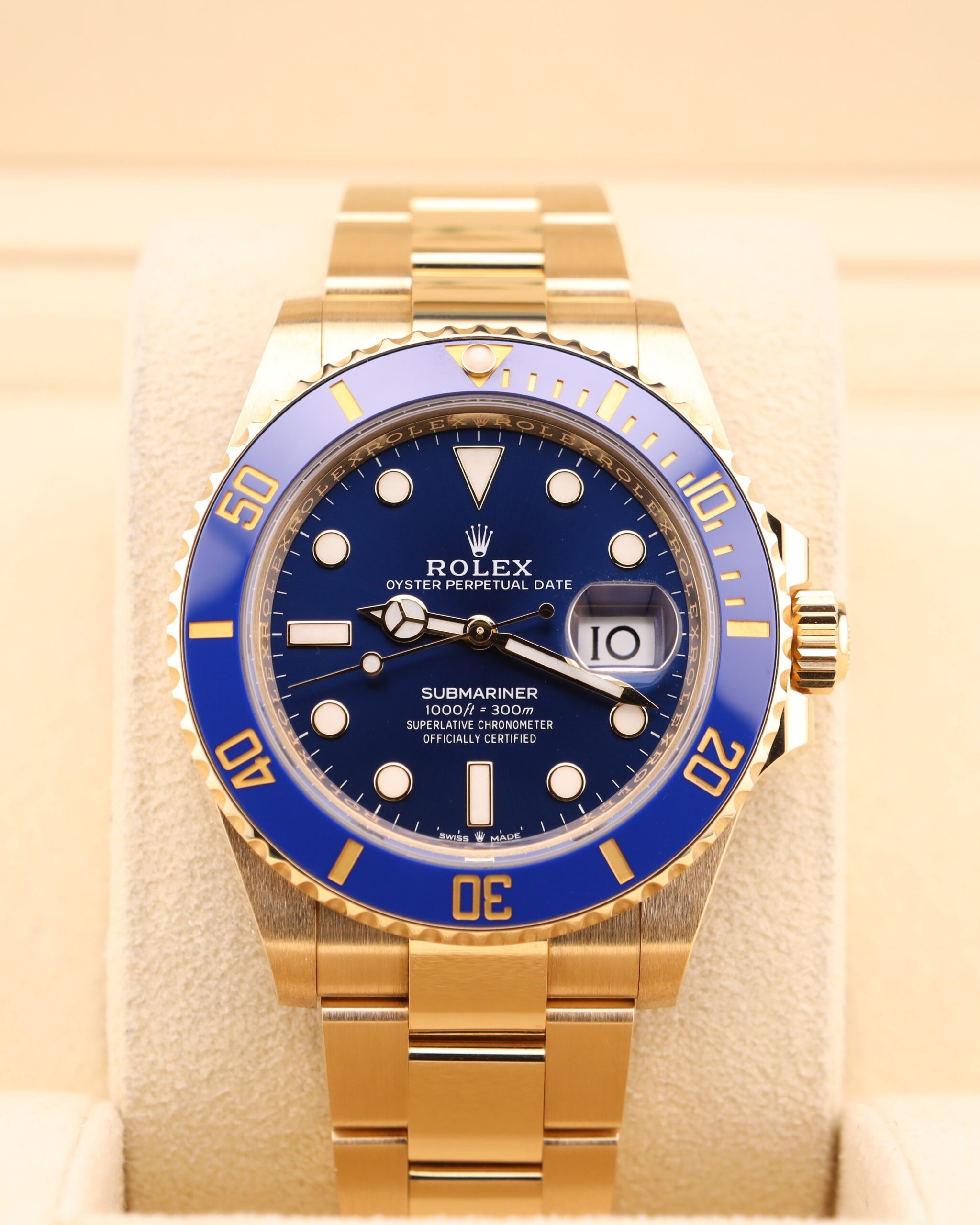 Yellow gold diver watch with blue bezel