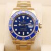 Gold Rolex Submariner with blue dial
