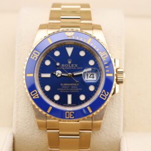Gold Rolex Submariner with blue dial